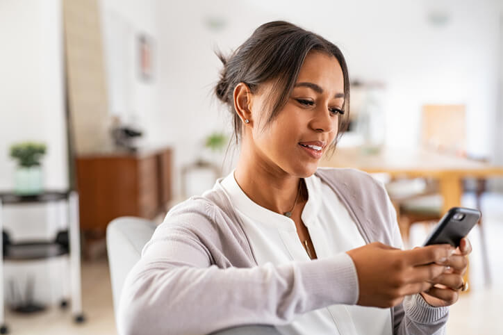 woman booking an appointment on her phone