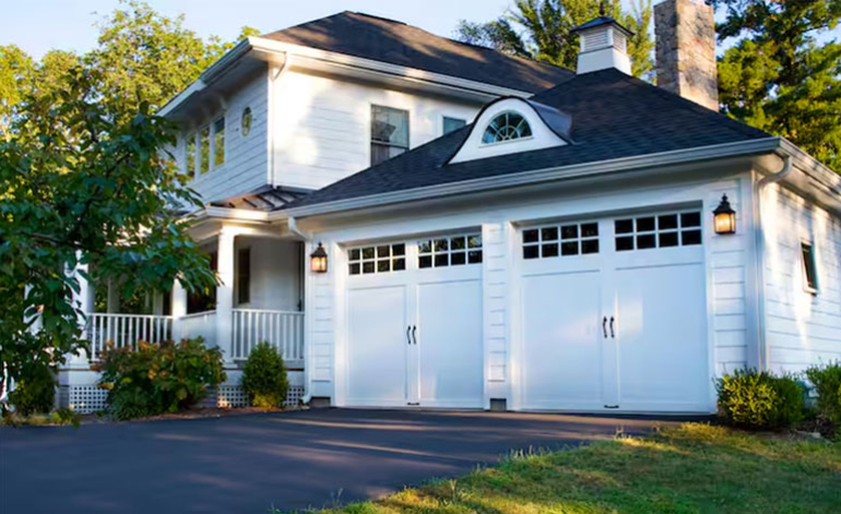 exterior of a white house with a white garage door