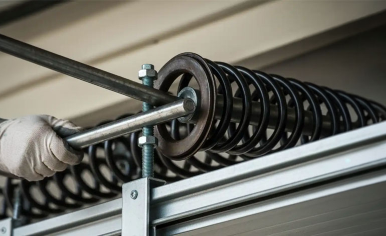 technician repairing a garage door