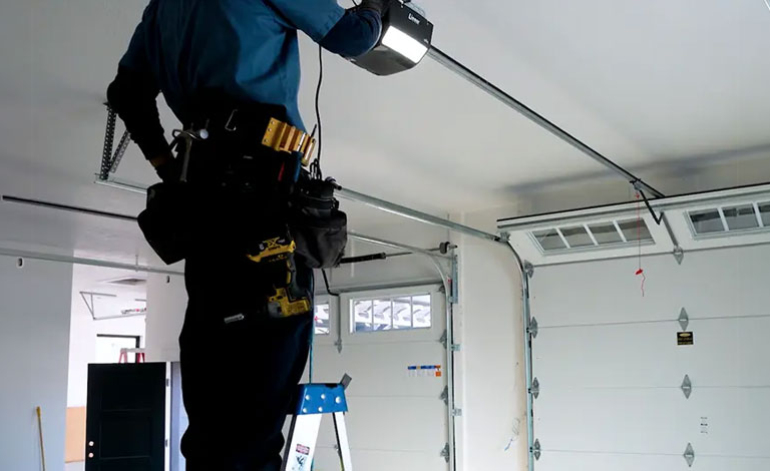 technician fixing a garage door opener