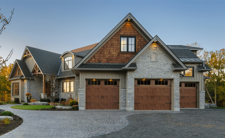 exterior of a white house with white garage doors in Sugar Land, TX