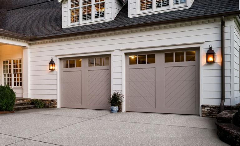 white house with tan garage doors