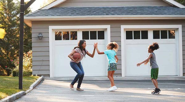 children playing in their driveway