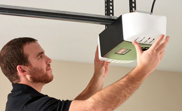 technician doing maintenance on a garage door opener