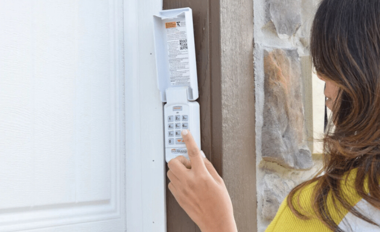 woman using a garage door keypad