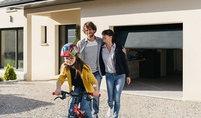 family walking outside on their driveway