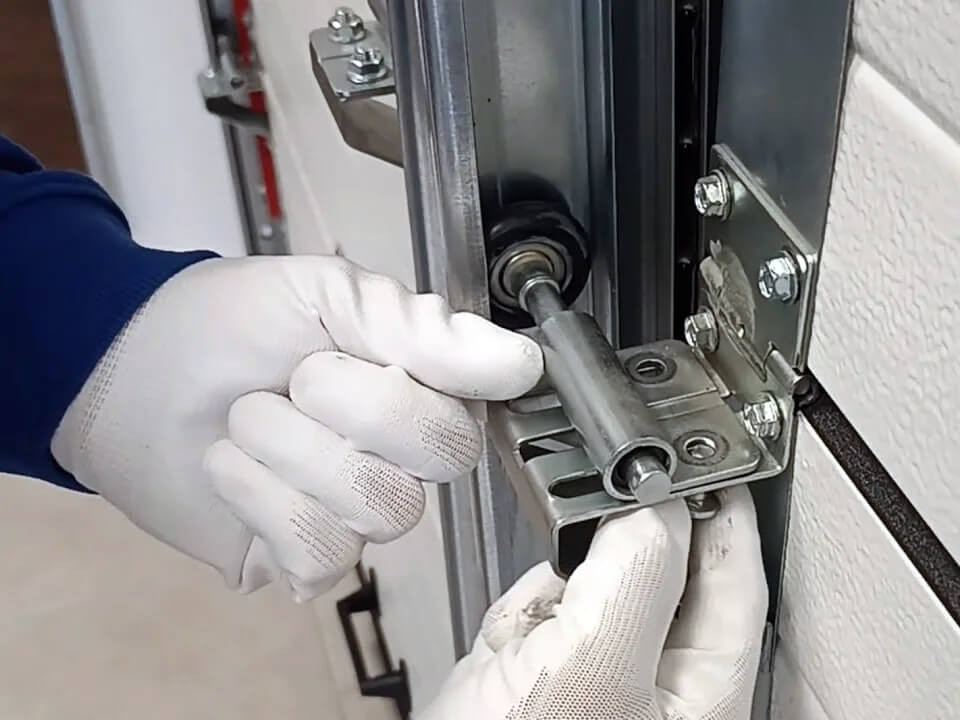 garage door roller being replaced