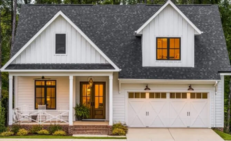 exterior of a white house with white garage doors