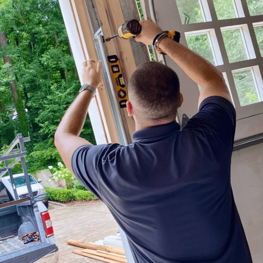 Garage360 staff working on garage door maintenance
