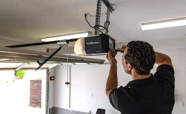 technician repairing a garage door opener