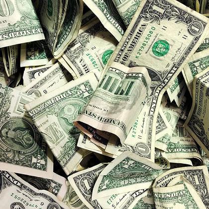 a pile of dollar bills