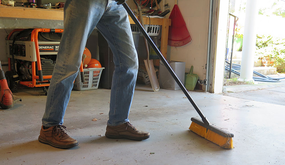 sweeping a garage floor