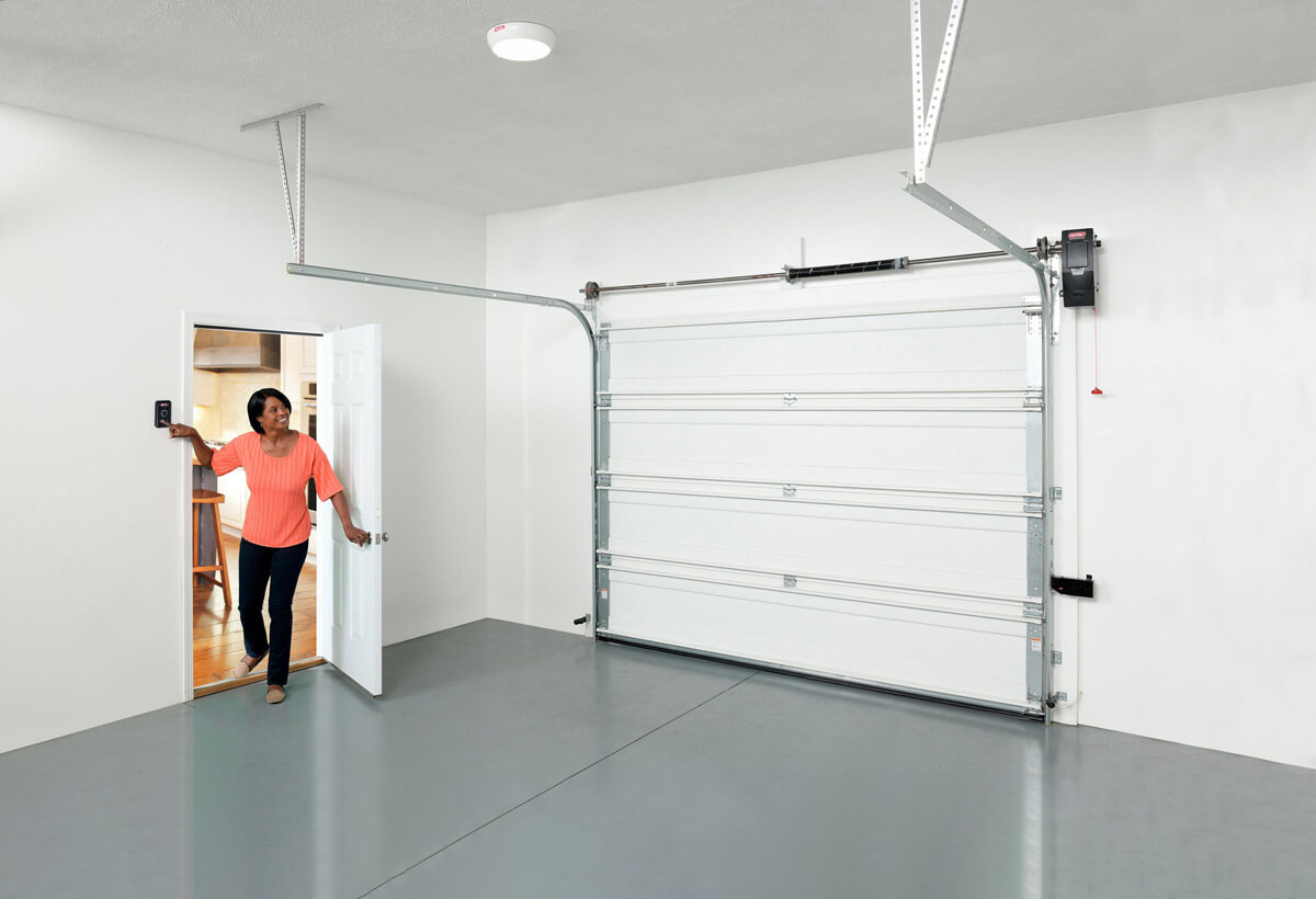 woman opening a garage door